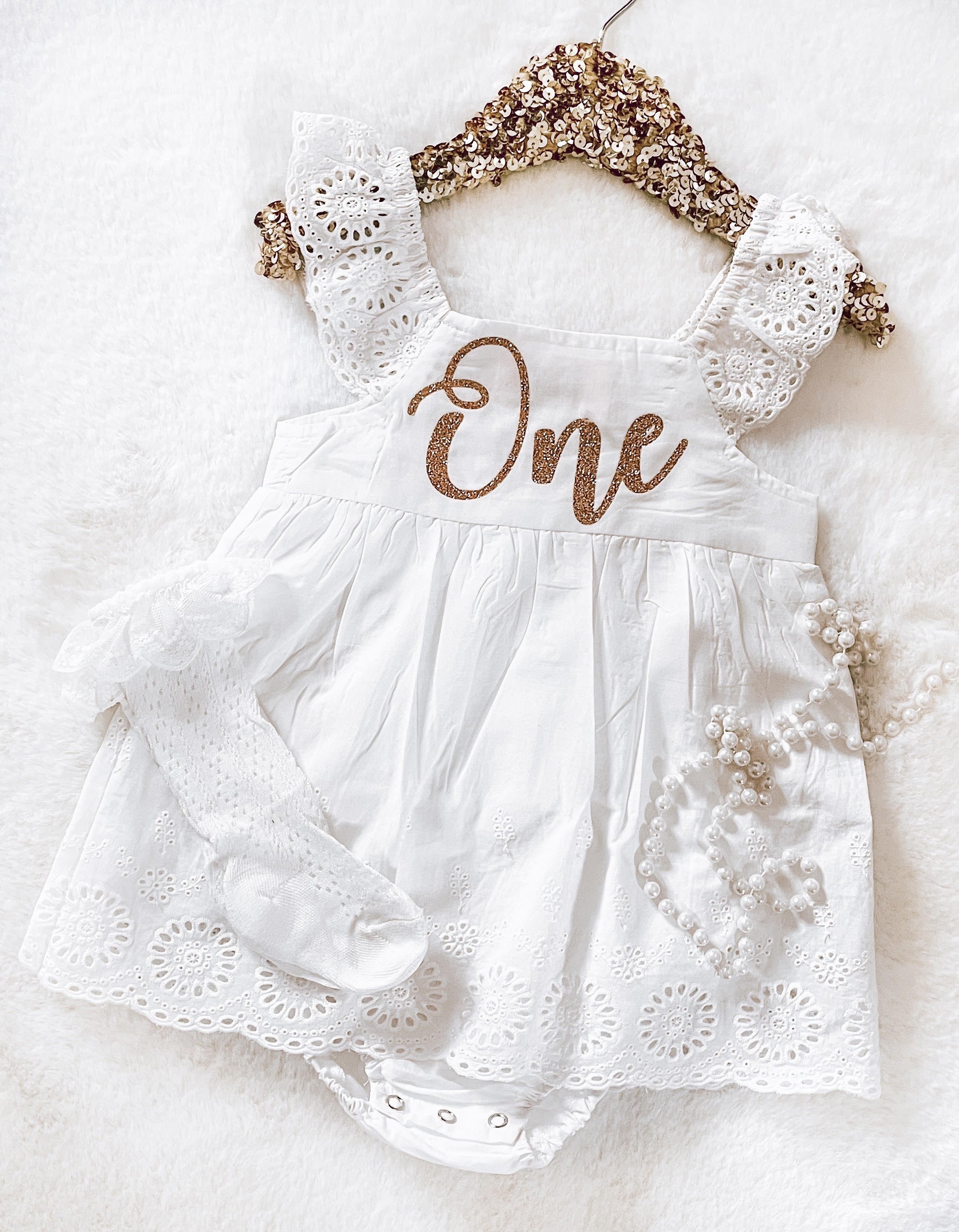 $17.50 EA - 6-12M X 2, 12-24M X 2 -- B - White Lace Sleeved Gold One Decal Skirted Romper